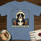 Let Go and Let Dog Bernese Mountain Dog T-Shirt flat lay in Blue Jean, featuring a vintage tarot card with a haloed tricolor Bernese Mountain Dog, paws raised, mountains rising behind her shoulders.