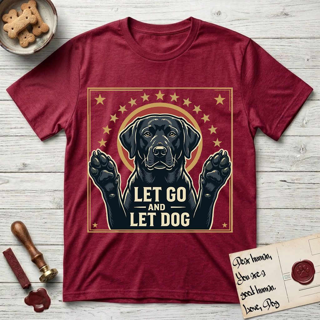 Let Go and Let Dog Black Lab T-Shirt flat lay in Antique Cherry Red, featuring a bold Americana star-badge of a haloed Black Lab with both front paws raised.