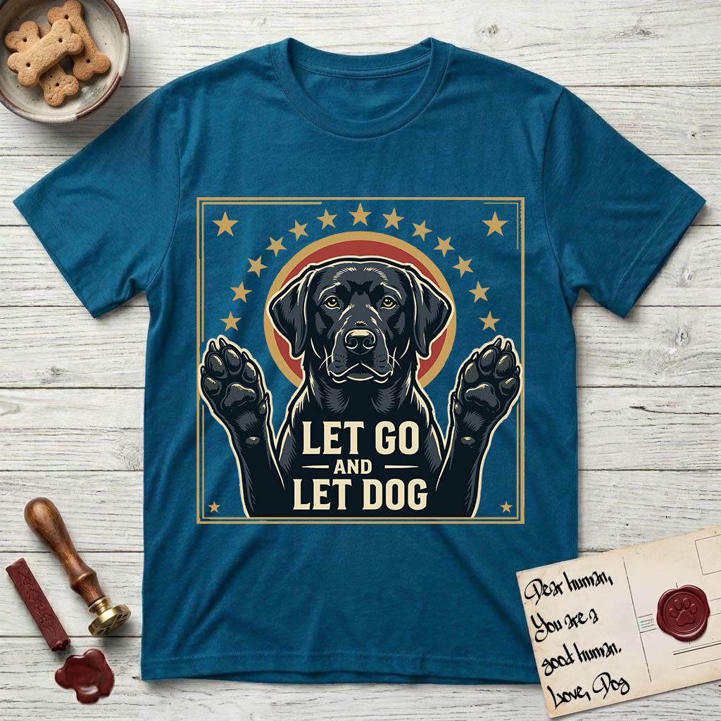 Let Go and Let Dog Black Lab T-Shirt flat lay in Antique Sapphire, featuring a bold Americana star-badge of a haloed Black Lab with both front paws raised.
