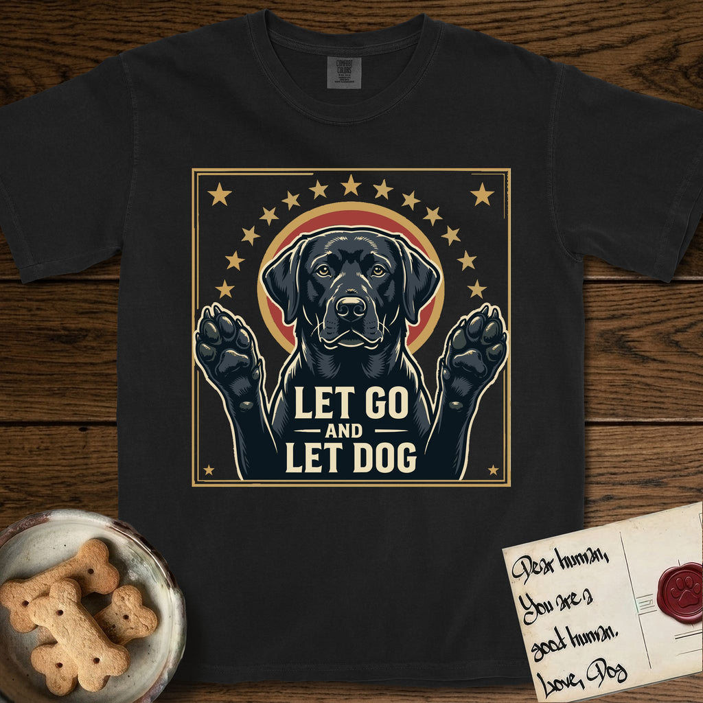 Let Go and Let Dog Black Lab T-Shirt flat lay in Black, featuring a bold Americana star-badge of a haloed Black Lab with both front paws raised.