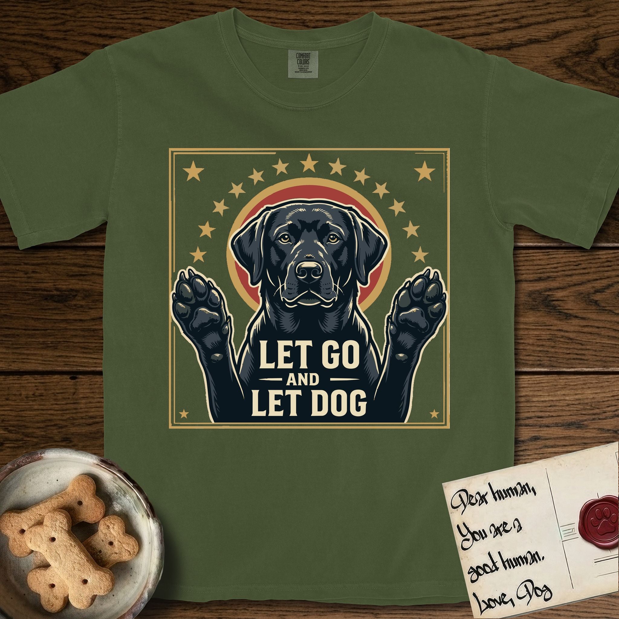 Let Go and Let Dog Black Lab T-Shirt flat lay in Hemp, featuring a bold Americana star-badge of a haloed Black Lab with both front paws raised.