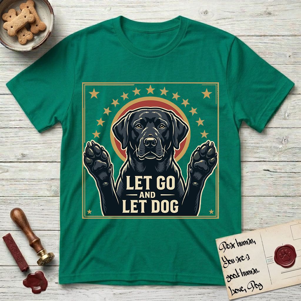 Let Go and Let Dog Black Lab T-Shirt flat lay in Kelly Green, featuring a bold Americana star-badge of a haloed Black Lab with both front paws raised.