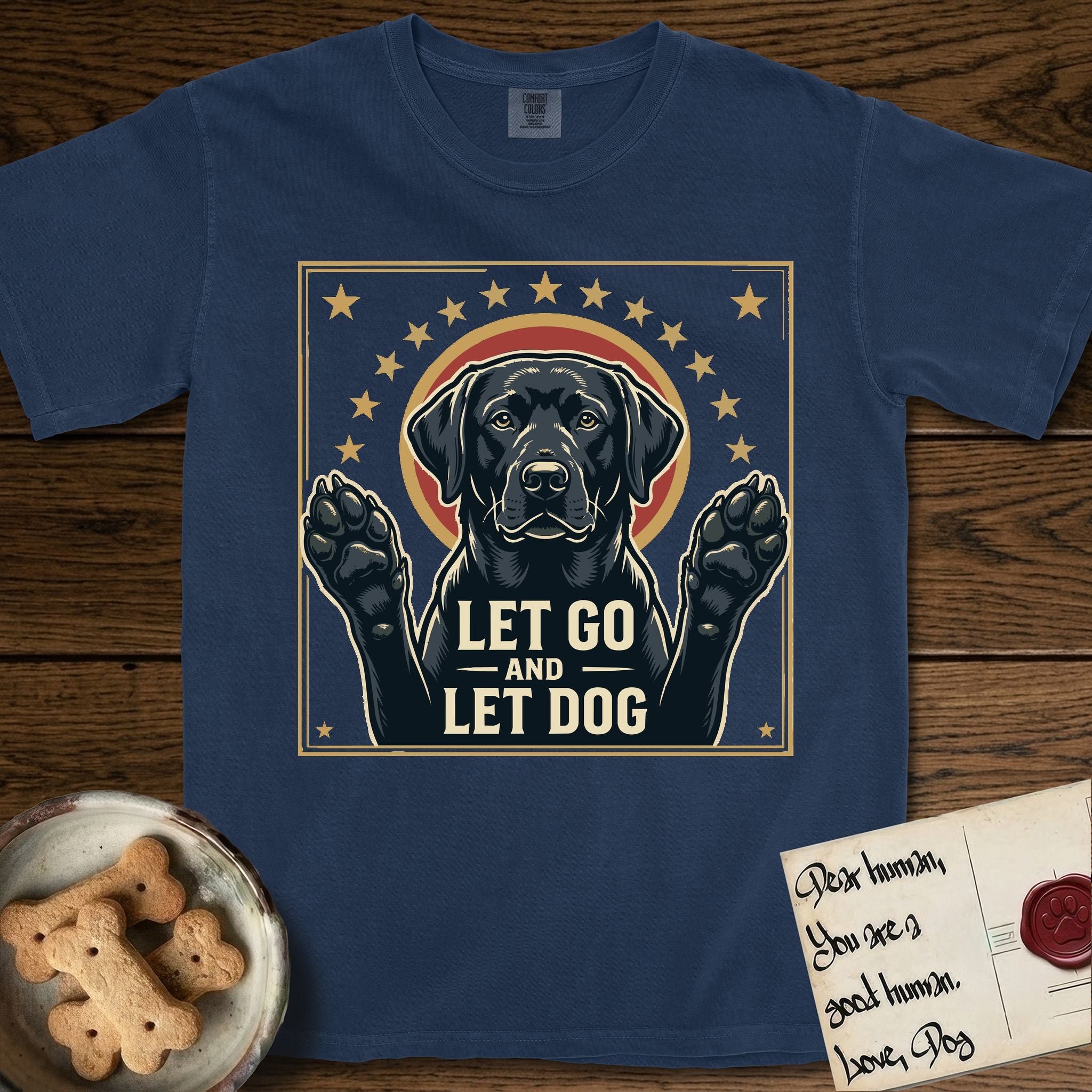 Let Go and Let Dog Black Lab T-Shirt flat lay in True Navy, featuring a bold Americana star-badge of a haloed Black Lab with both front paws raised.