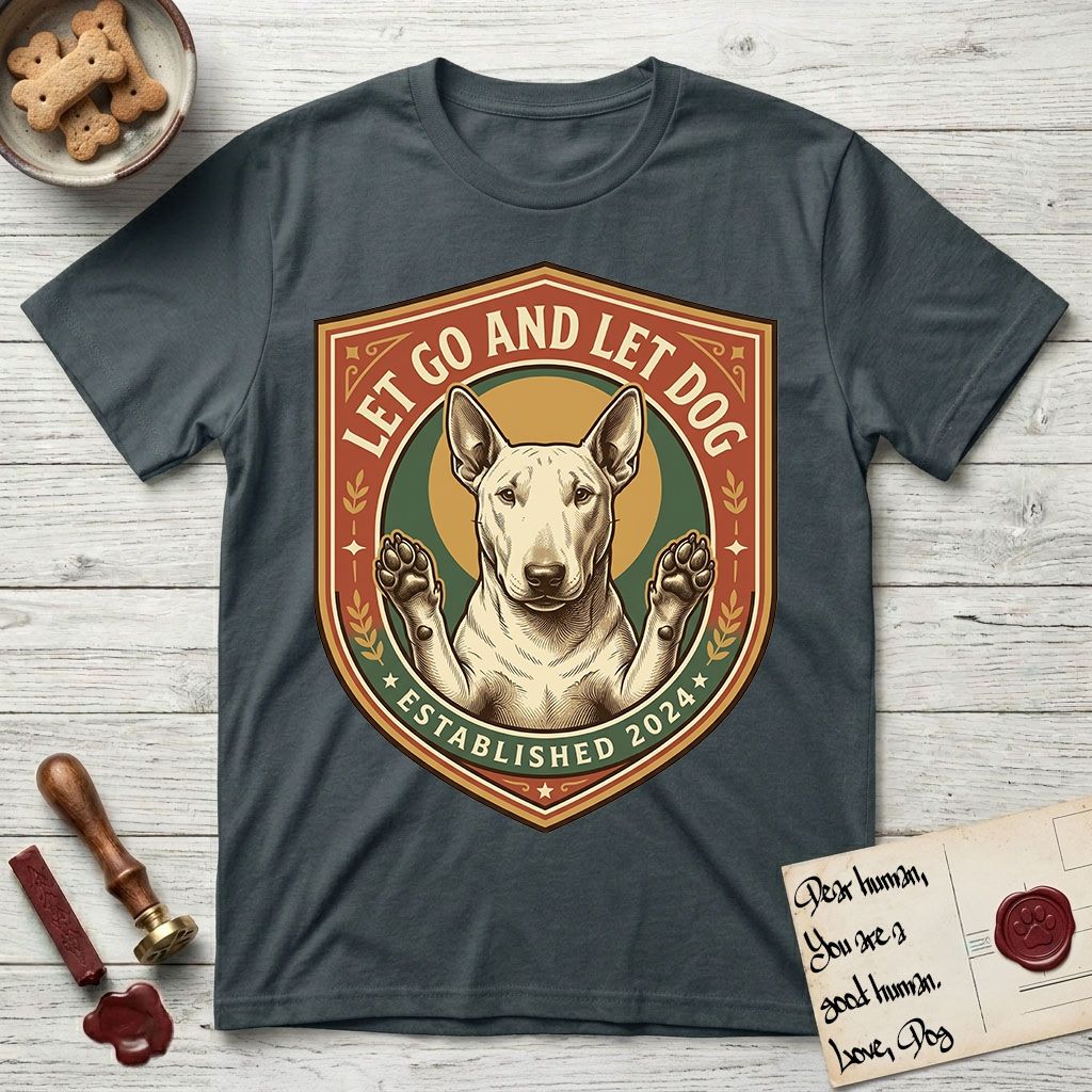 Let Go and Let Dog Bull Terrier T-Shirt flat lay in Dark Heather Grey, featuring a vintage badge of a haloed Bull Terrier with paws raised in blessing.