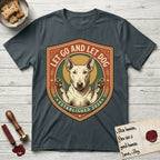 Let Go and Let Dog Bull Terrier T-Shirt flat lay in Dark Heather Grey, featuring a vintage badge of a haloed Bull Terrier with paws raised in blessing.