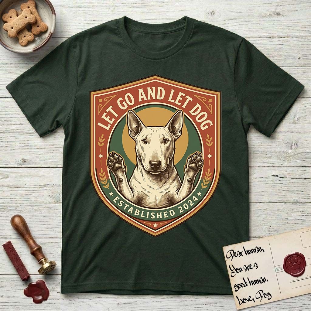 Let Go and Let Dog Bull Terrier T-Shirt flat lay in Forest Green, featuring a vintage badge of a haloed Bull Terrier with paws raised in blessing.