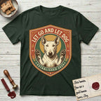 Let Go and Let Dog Bull Terrier T-Shirt flat lay in Forest Green, featuring a vintage badge of a haloed Bull Terrier with paws raised in blessing.