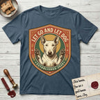 Let Go and Let Dog Bull Terrier T-Shirt flat lay in Indigo Blue, featuring a vintage badge of a haloed Bull Terrier with paws raised in blessing.