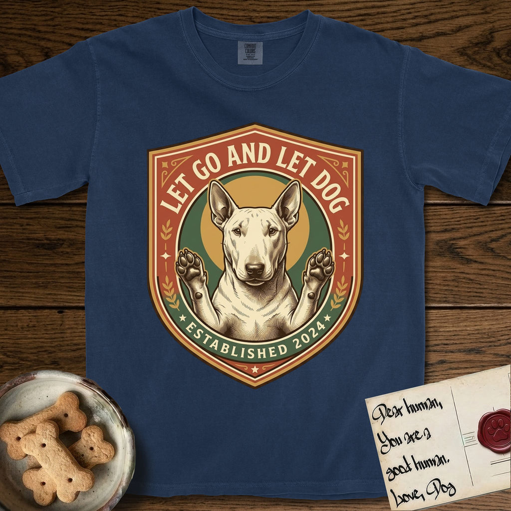 Let Go and Let Dog Bull Terrier T-Shirt flat lay in True Navy, featuring a vintage badge of a haloed Bull Terrier with paws raised in blessing.