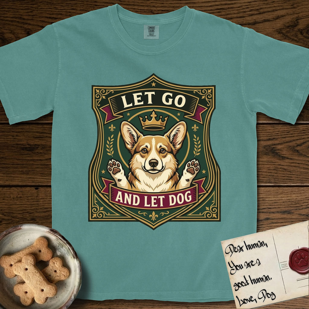 Let Go and Let Dog Corgi T-Shirt flat lay in Blue Spruce, featuring a royal heraldic shield badge of a crowned, haloed Corgi with paws raised.