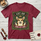 Let Go and Let Dog Corgi T-Shirt flat lay in Cardinal Red, featuring a royal heraldic shield badge of a crowned, haloed Corgi with paws raised.