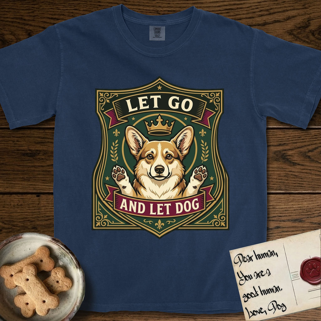 Let Go and Let Dog Corgi T-Shirt flat lay in True Navy, featuring a royal heraldic shield badge of a crowned, haloed Corgi with paws raised.