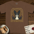 Let Go and Let Dog French Bulldog T-Shirt flat lay in Espresso, featuring an Art Deco arch with a haloed brindle French Bulldog, bat ears erect and paws raised, gold sunburst rays behind him.
