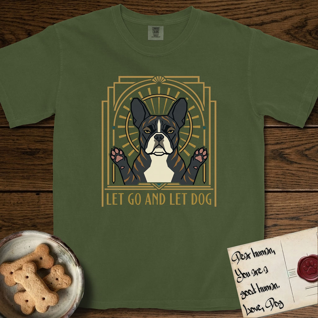 Let Go and Let Dog French Bulldog T-Shirt flat lay in Hemp, featuring an Art Deco arch with a haloed brindle French Bulldog, bat ears erect and paws raised, gold sunburst rays behind him.