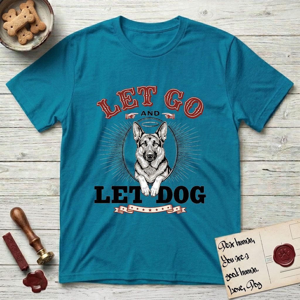 Let Go and Let Dog German Shepherd T-Shirt flat lay in Tropical Blue, featuring a vintage letterpress engraving of a haloed German Shepherd framed by a sunburst oval.