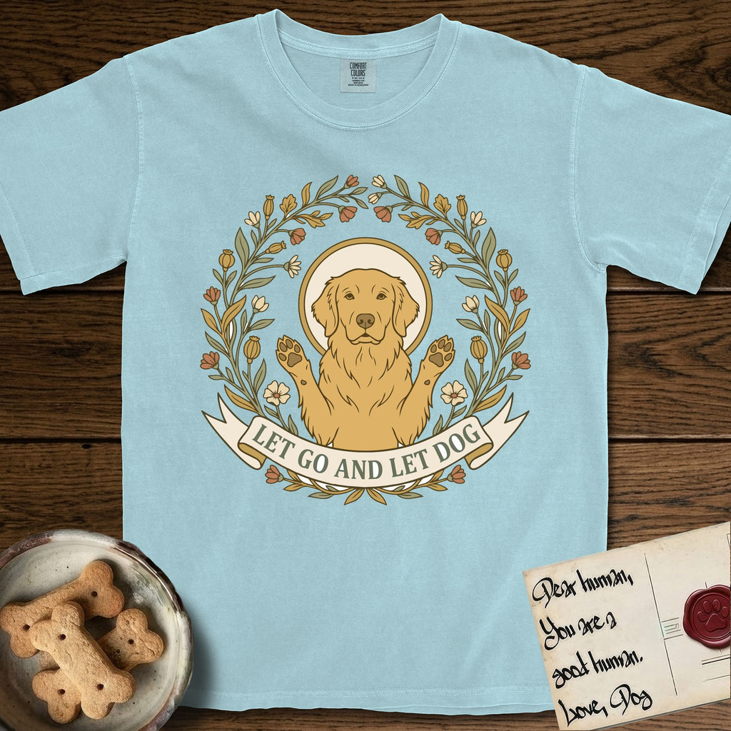 Let Go and Let Dog Golden Retriever T-Shirt flat lay in Chambray, featuring an Art Nouveau wildflower wreath around a haloed Golden Retriever with front paws raised.