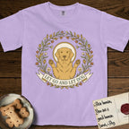 Let Go and Let Dog Golden Retriever T-Shirt flat lay in Orchid, featuring an Art Nouveau wildflower wreath around a haloed Golden Retriever with front paws raised.