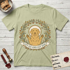 Let Go and Let Dog Golden Retriever T-Shirt flat lay in Pistachio, featuring an Art Nouveau wildflower wreath around a haloed Golden Retriever with front paws raised.