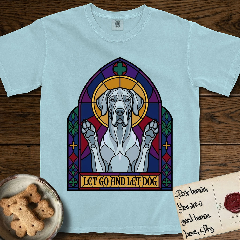 Let Go and Let Dog Great Dane T-Shirt flat lay in Chambray, featuring a stained-glass cathedral window of a haloed Great Dane with paws raised.