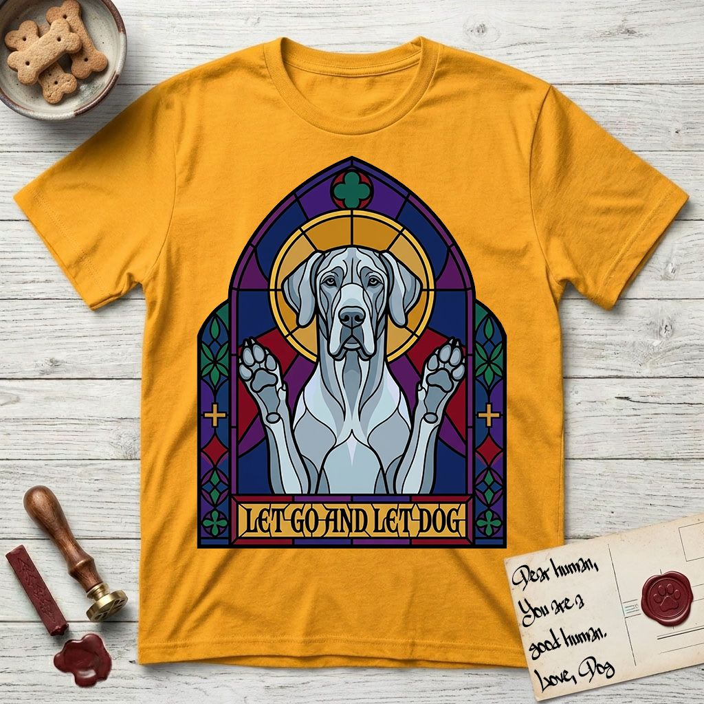 Let Go and Let Dog Great Dane T-Shirt flat lay in Gold, featuring a stained-glass cathedral window of a haloed Great Dane with paws raised.
