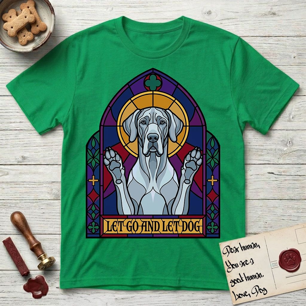 Let Go and Let Dog Great Dane T-Shirt flat lay in Irish Green, featuring a stained-glass cathedral window of a haloed Great Dane with paws raised.