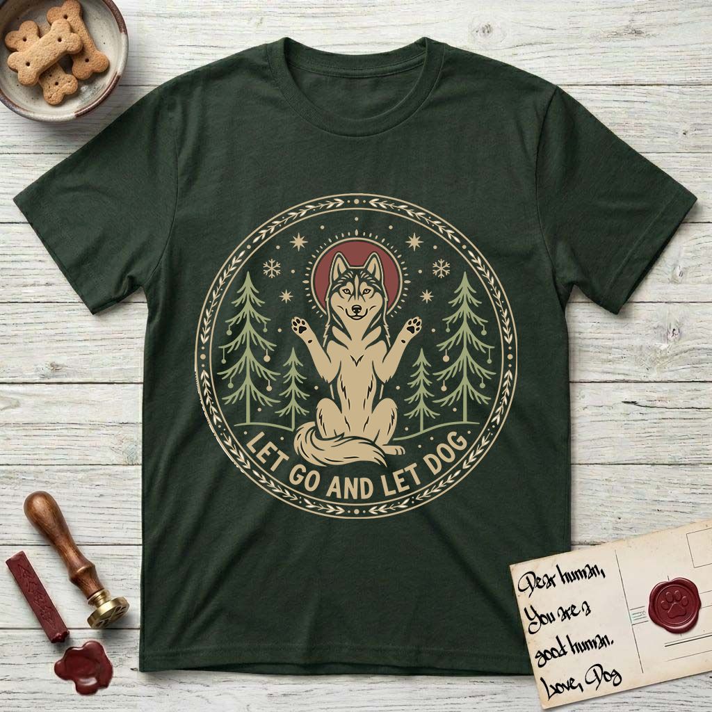 Let Go and Let Dog Husky T-Shirt flat lay in Forest Green, featuring a winter woodland seal of a haloed Husky sitting with paws raised among pine trees.
