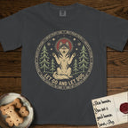 Let Go and Let Dog Husky T-Shirt flat lay in Graphite, featuring a winter woodland seal of a haloed Husky sitting with paws raised among pine trees.