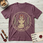 Let Go and Let Dog Husky T-Shirt flat lay in Heather Maroon, featuring a winter woodland seal of a haloed Husky sitting with paws raised among pine trees.