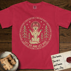 Let Go and Let Dog Husky T-Shirt flat lay in Red, featuring a winter woodland seal of a haloed Husky sitting with paws raised among pine trees.