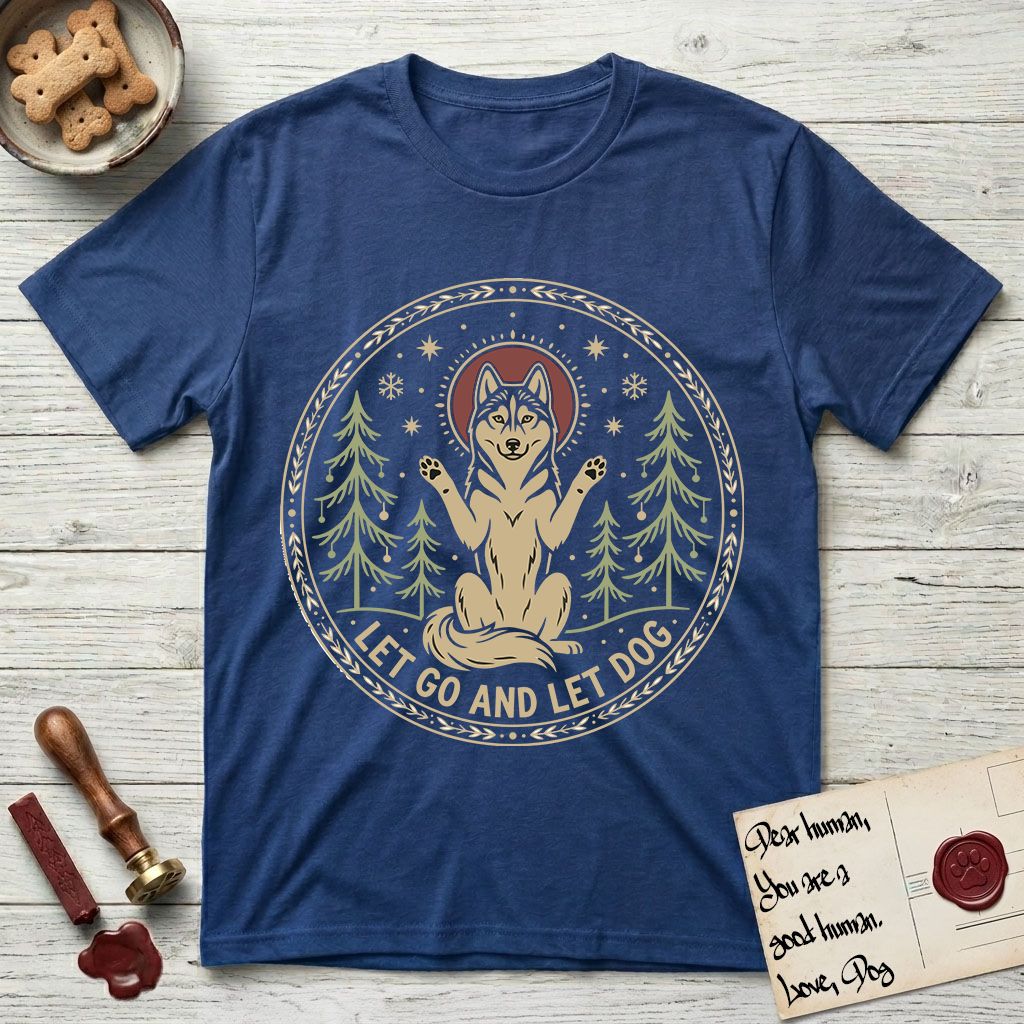 Let Go and Let Dog Husky T-Shirt flat lay in Royal, featuring a winter woodland seal of a haloed Husky sitting with paws raised among pine trees.