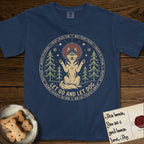 Let Go and Let Dog Husky T-Shirt flat lay in True Navy, featuring a winter woodland seal of a haloed Husky sitting with paws raised among pine trees.
