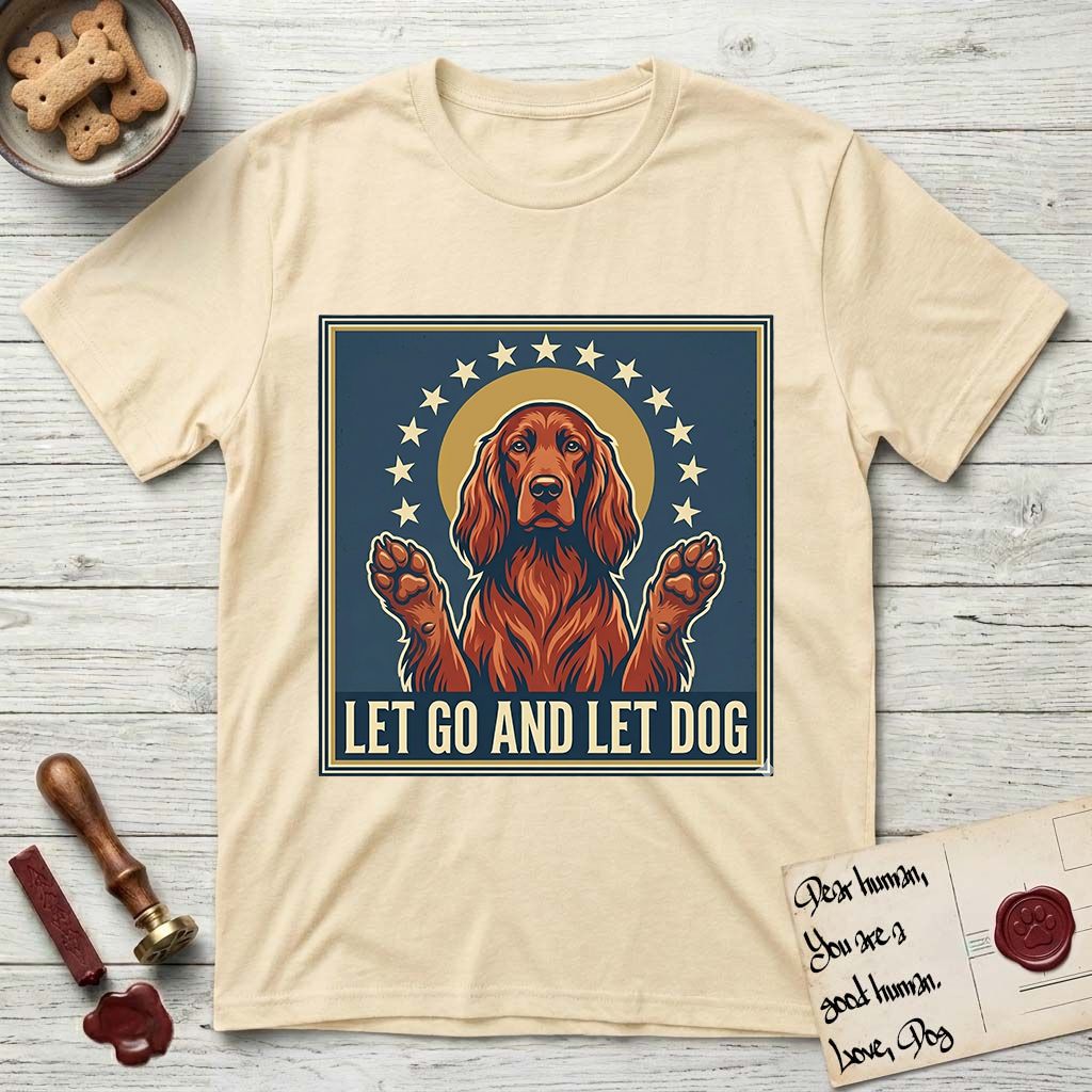 Let Go and Let Dog Irish Setter T-Shirt flat lay in Natural, featuring a vintage devotional poster of a haloed Irish Setter with paws raised and a ring of stars.