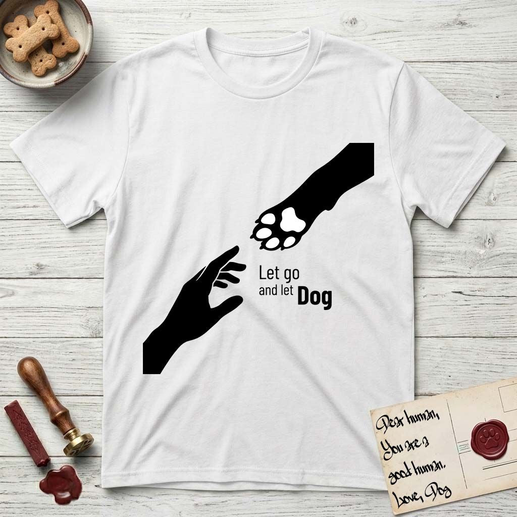 Let Go and Let Dog Paw T-Shirt flat lay in White, featuring a minimalist silhouette of a human hand and a Dog paw reaching toward each other, almost touching.