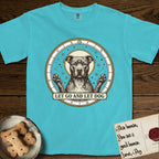 Let Go and Let Dog Pitbull T-Shirt flat lay in Lagoon Blue, featuring an antique engraved celestial star chart with a haloed Pitbull at the center, natural folded ears and paws raised, stars carved across his coat.