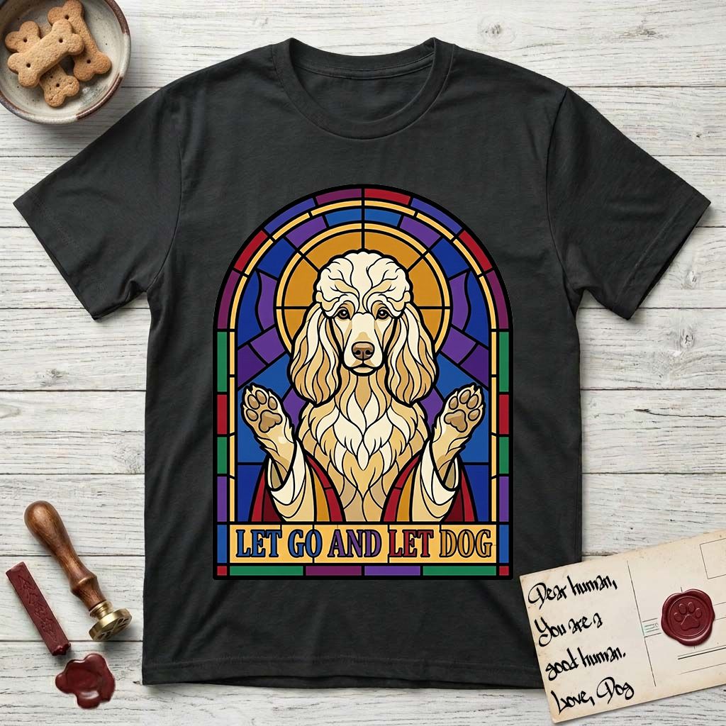Let Go and Let Dog Poodle T-Shirt flat lay in Black, featuring a stained-glass illustration of a haloed Poodle with paws raised.