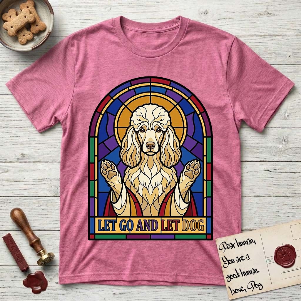 Let Go and Let Dog Poodle T-Shirt flat lay in Heather Heliconia, featuring a stained-glass illustration of a haloed Poodle with paws raised.