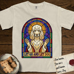 Let Go and Let Dog Poodle T-Shirt flat lay in Ivory, featuring a stained-glass illustration of a haloed Poodle with paws raised.