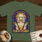 Let Go and Let Dog Poodle T-Shirt flat lay in Moss, featuring a stained-glass illustration of a haloed Poodle with paws raised.