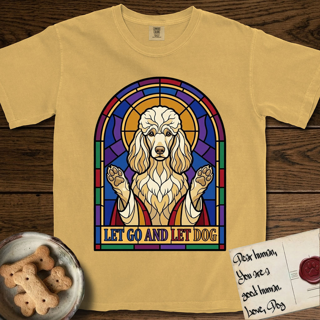 Let Go and Let Dog Poodle T-Shirt flat lay in Mustard, featuring a stained-glass illustration of a haloed Poodle with paws raised.