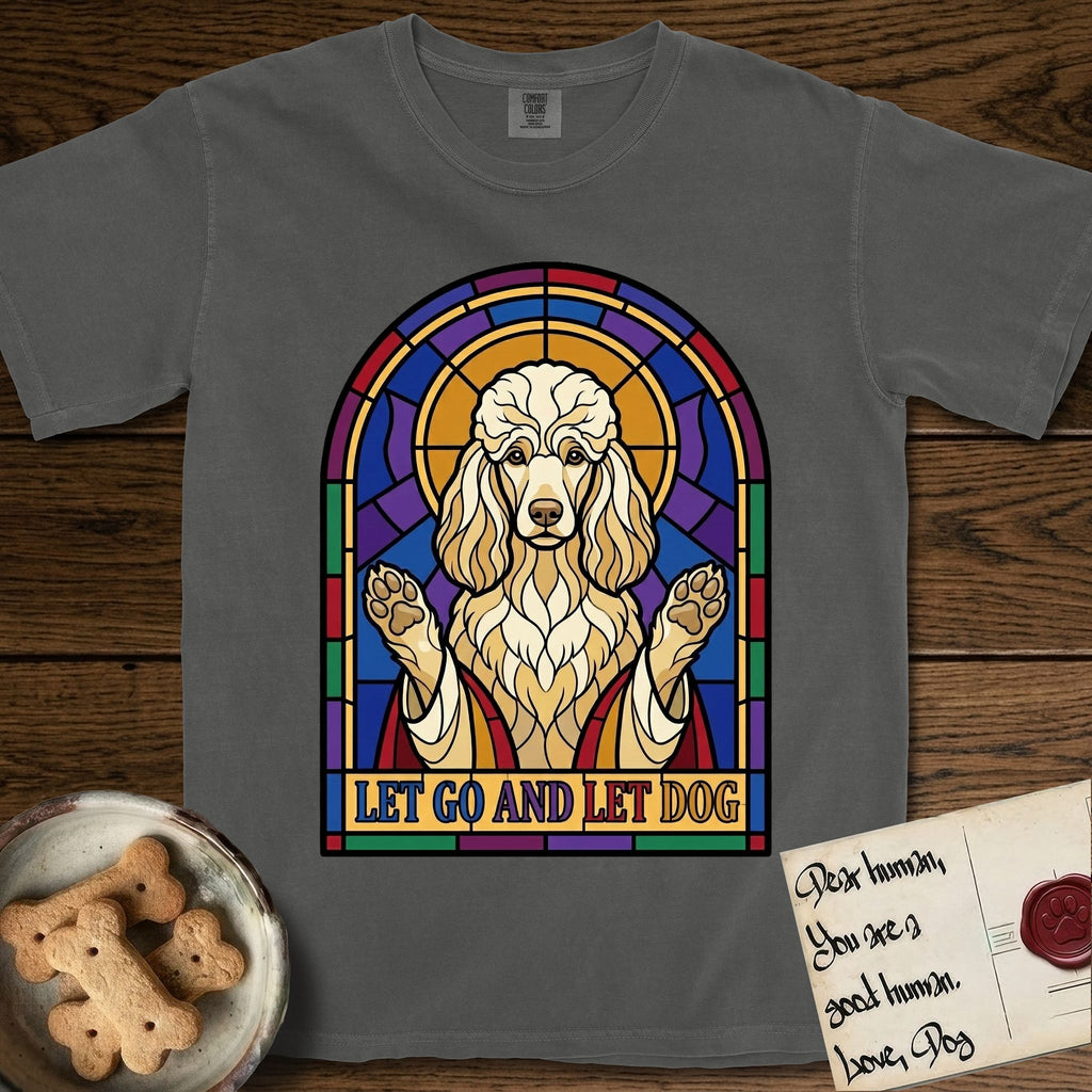 Let Go and Let Dog Poodle T-Shirt flat lay in Pepper, featuring a stained-glass illustration of a haloed Poodle with paws raised.