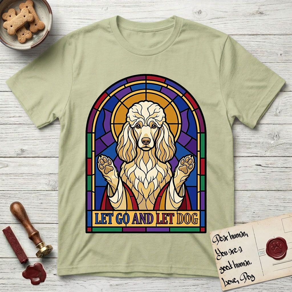 Let Go and Let Dog Poodle T-Shirt flat lay in Pistachio, featuring a stained-glass illustration of a haloed Poodle with paws raised.