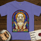 Let Go and Let Dog Poodle T-Shirt flat lay in Violet, featuring a stained-glass illustration of a haloed Poodle with paws raised.