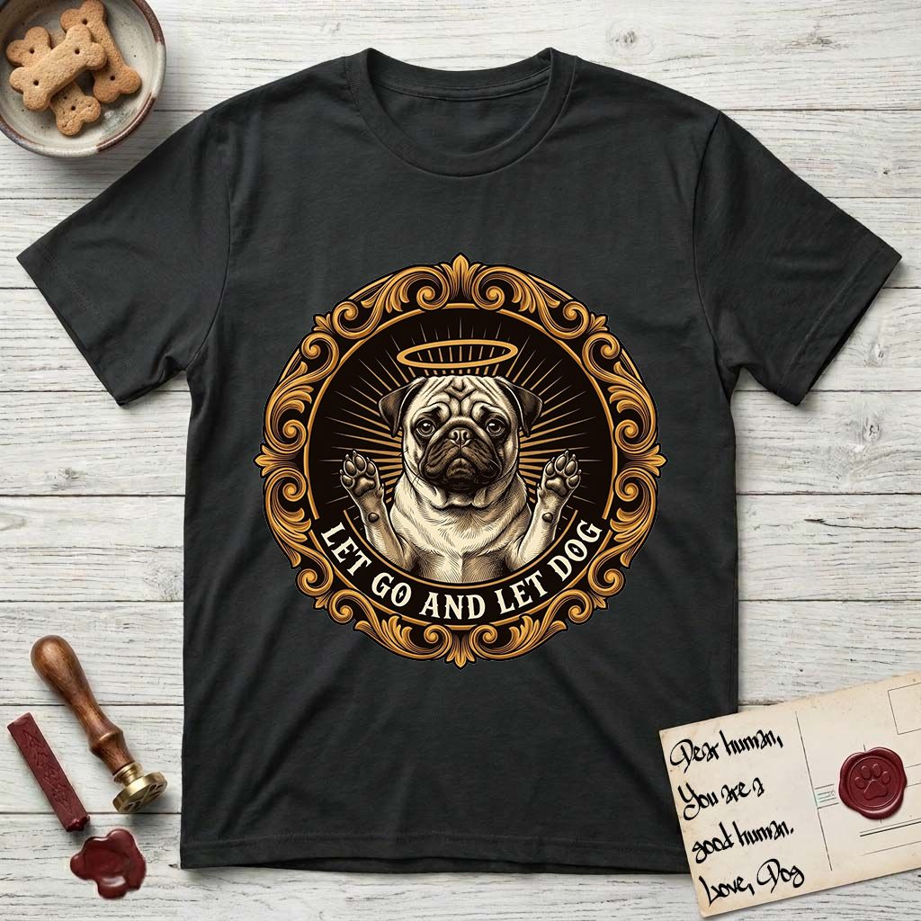 Let Go and Let Dog Pug T-Shirt flat lay in Black, featuring a baroque medallion engraving of a haloed Pug with paws raised, framed in gold scrollwork.