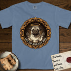 Let Go and Let Dog Pug T-Shirt flat lay in Blue Jean, featuring a baroque medallion engraving of a haloed Pug with paws raised, framed in gold scrollwork.