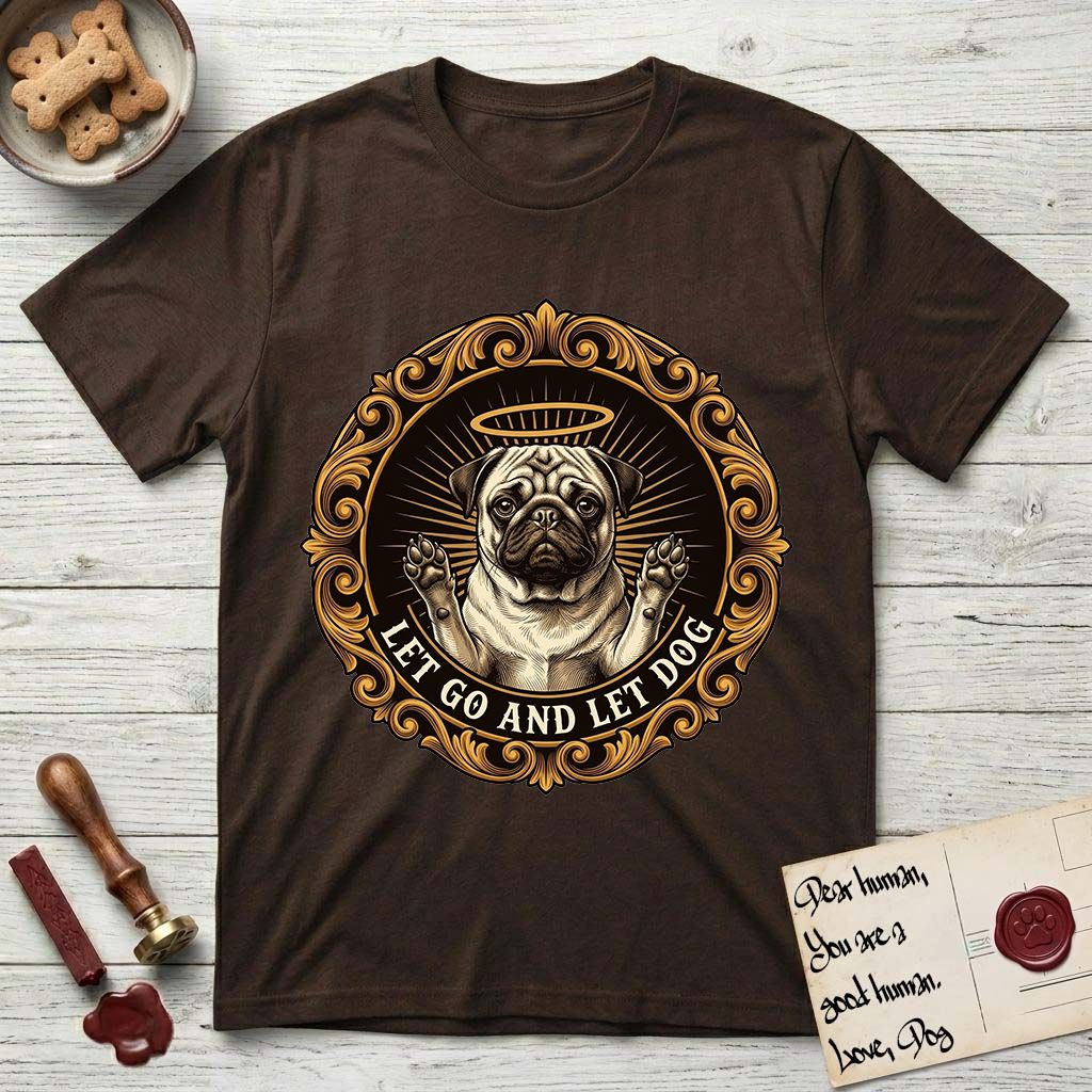 Let Go and Let Dog Pug T-Shirt flat lay in Dark Chocolate, featuring a baroque medallion engraving of a haloed Pug with paws raised, framed in gold scrollwork.