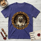 Let Go and Let Dog Pug T-Shirt flat lay in Metro Blue, featuring a baroque medallion engraving of a haloed Pug with paws raised, framed in gold scrollwork.