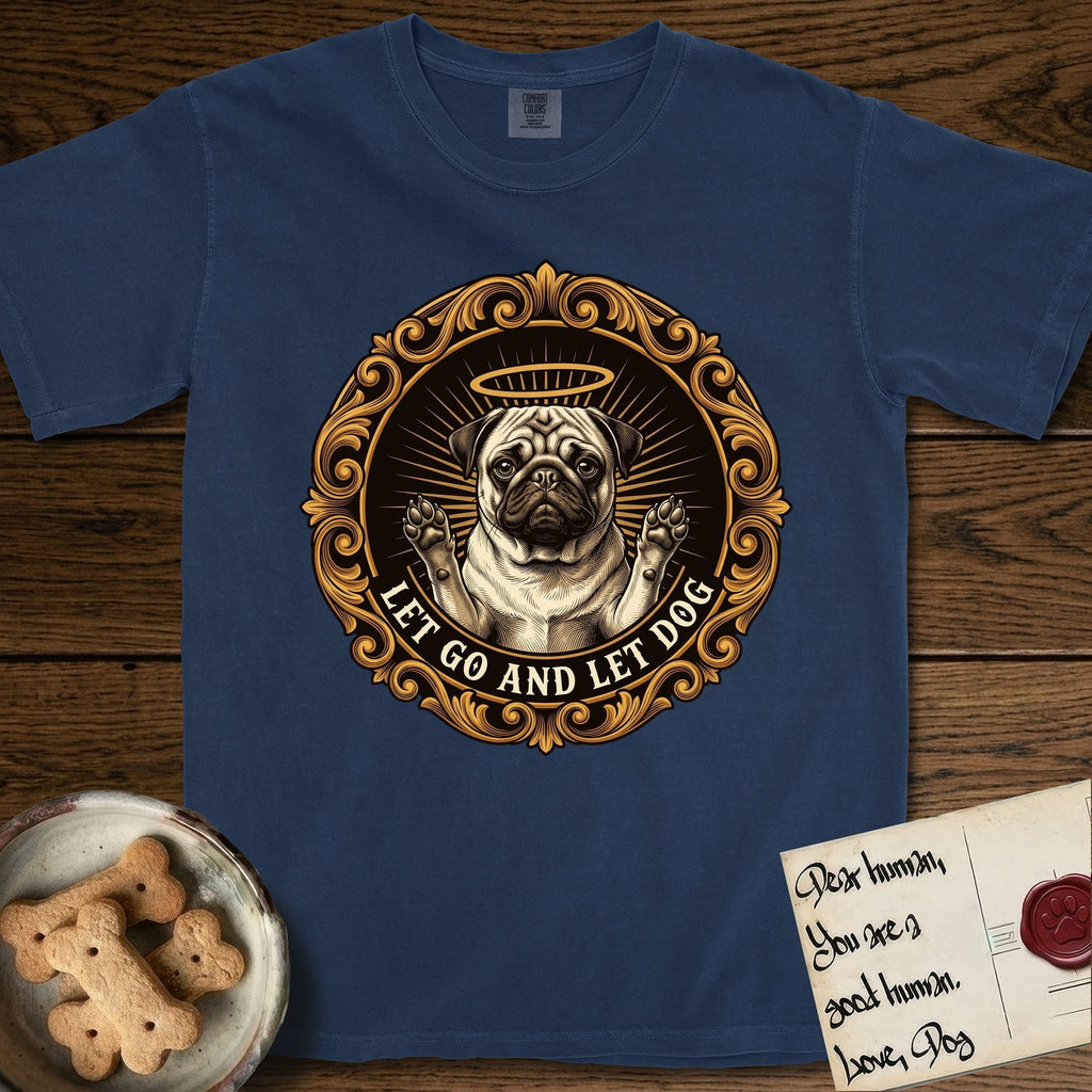 Let Go and Let Dog Pug T-Shirt flat lay in True Navy, featuring a baroque medallion engraving of a haloed Pug with paws raised, framed in gold scrollwork.