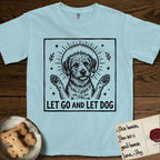 Let Go and Let Dog Rescue Mutt T-Shirt flat lay in Chambray, featuring a bold black-and-white woodcut of a haloed scruffy rescue mutt with both front paws raised.