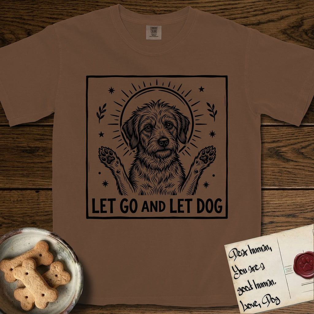 Let Go and Let Dog Rescue Mutt T-Shirt flat lay in Espresso, featuring a bold black-and-white woodcut of a haloed scruffy rescue mutt with both front paws raised.