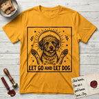 Let Go and Let Dog Rescue Mutt T-Shirt flat lay in Gold, featuring a bold black-and-white woodcut of a haloed scruffy rescue mutt with both front paws raised.